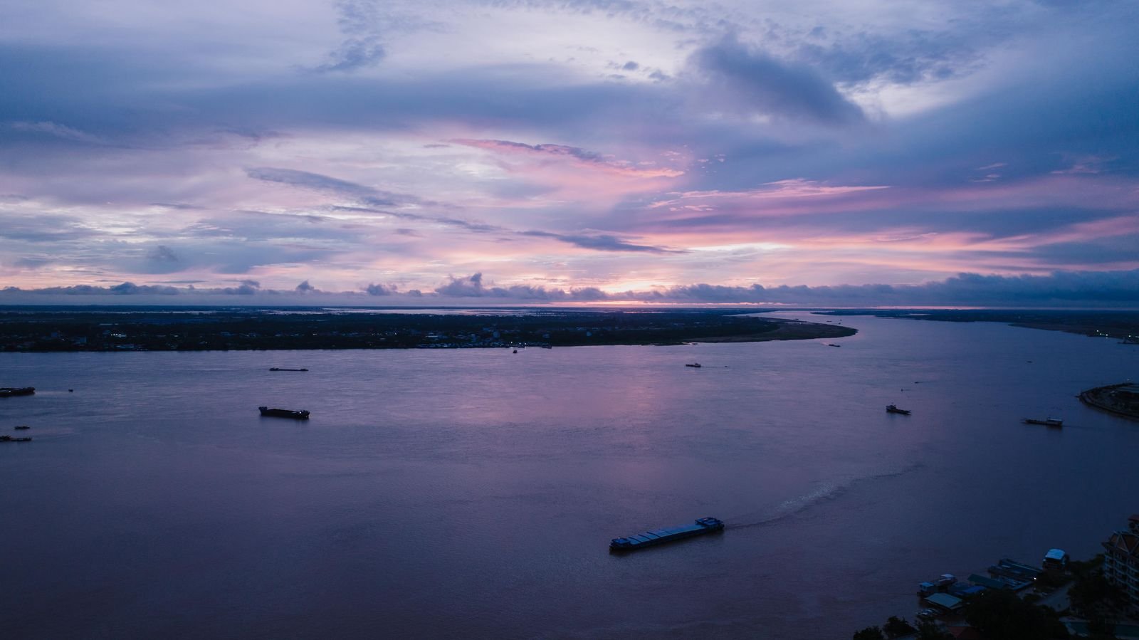 Boats on the Mekong river at sunset